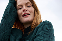 woman in a green sweater